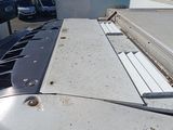 an image of a flatbed truck with a flat bed