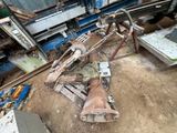 a pile of junk on the ground next to a truck