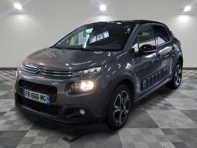 the grey citrole is parked on a checkered floor