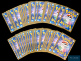 a lot of pokemon cards that are on the table