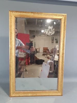 a man taking a picture of himself in a mirror