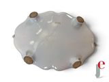 a white plate with a wooden handle on a white surface