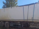 a large white truck that is parked on the side of the road