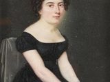 portrait of a woman in a black dress sitting on a chair