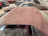 many old cars that are parked in a lot