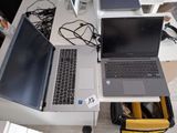 two laptops that are sitting on a desk