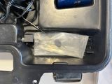 a cell phone in a plastic case with wires in it