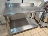 a stainless steel table in a commercial kitchen