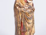 an image of a statue of a woman holding a baby