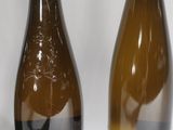 three bottles of wine sitting next to each other on a table
