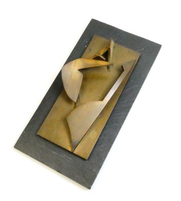 a metal sculpture of a man with a tie on it