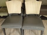 four chairs that are sitting on the floor