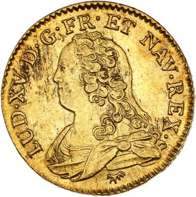 gros plan d'une pièce d'or sur laquelle figure une femme