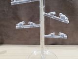 a glass display with a bunch of birds on it