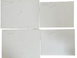 four pieces of white paper with writing on them on a white surface