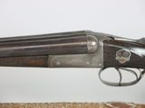 an old gun that is sitting on top of a table