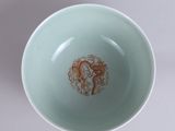 a bowl with a brown substance in it sitting on a table