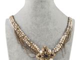 a close up of a necklace on a mannequin mannequin