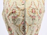 a close up of a dress on a mannequin with flowers on it