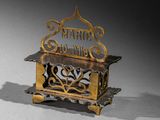 a small metal box with a sign on top of it
