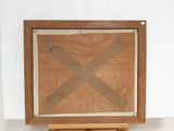 a picture of a wooden easel with a piece of tape on it