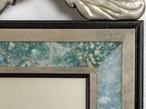 a picture of a mirror that is on the wall