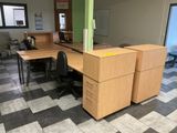 an image of an office cubicle with a desk and two chairs