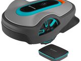 a robotic lawn mower with a remote control and a charger