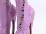 purple high heel boots with laces and buttons on the side of them