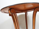 a wooden table with a glass top on a white background