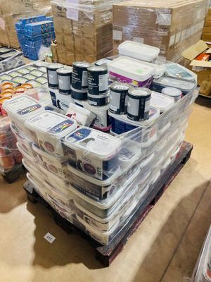 boxes of food are stacked on a pallet in a warehouse