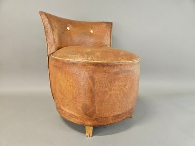 a chair that is made out of wood and has a seat made out of leather