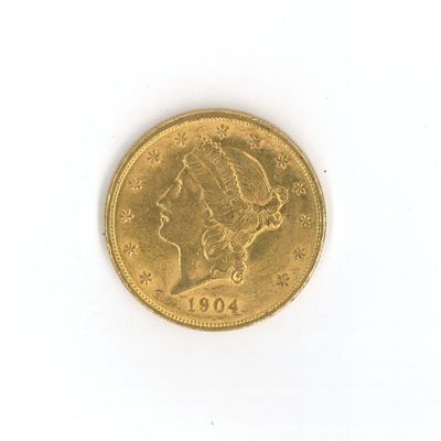 une image d'une pièce d'or sur une surface blanche