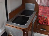 a small kitchen in the back of a camper