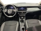 the interior of a car with a steering wheel, dashboard, and dashboard controls