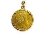 an image of a gold coin with a woman ' s face on it