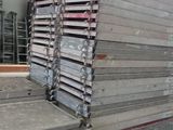 many stacks of steel bars stacked on top of each other