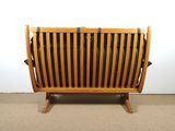 a wooden bench with black and white stripes on it