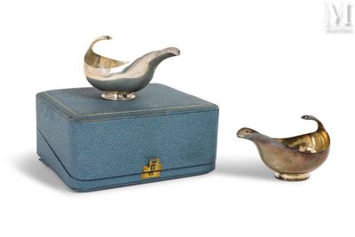 a small blue box with a silver bird on it and a small blue box with a silver bird on it