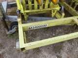 a close up of a yellow forklift with a number plate on it