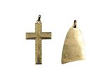 two pieces of gold metal with a cross on top of it