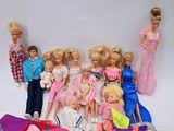 a lot of barbie dolls that are sitting on a table