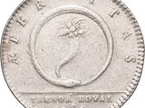 a close up of a coin on a white background