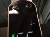 a person holding a remote control in their hand