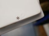 a white laptop with a star on the screen