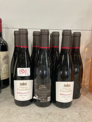 several bottles of wine are lined up on a counter
