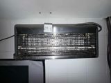 an old air conditioner sitting on top of a tiled wall