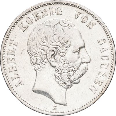 une vieille pièce d'argent sur laquelle est représenté le visage d'un homme