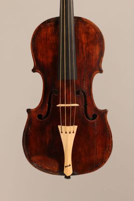 a close up of a violin with a bow on a white background