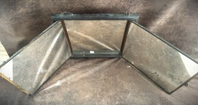 two mirrors that are sitting on a couch
